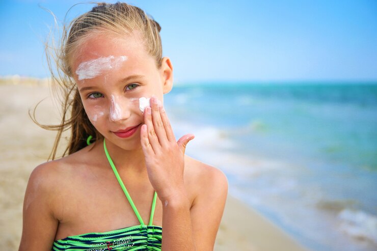 girl-applying-protective-sunscreen-face_104376-885